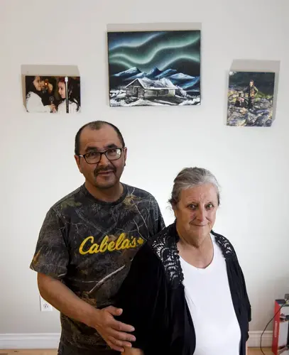 David and Charlotte Wolfrey pose for a portrait in their home in Rigolet, Labrador. Charlotte, an elder and elected leader of the small Inuit community of Rigolet, worries that methylmercury poisoning from a recently completed hydropower project will destroy the community's deep cultural connection to seals and other wild-caught food. Image by Michael Seamans / The Weather Channel. Canada, 2019.</p>
<p>