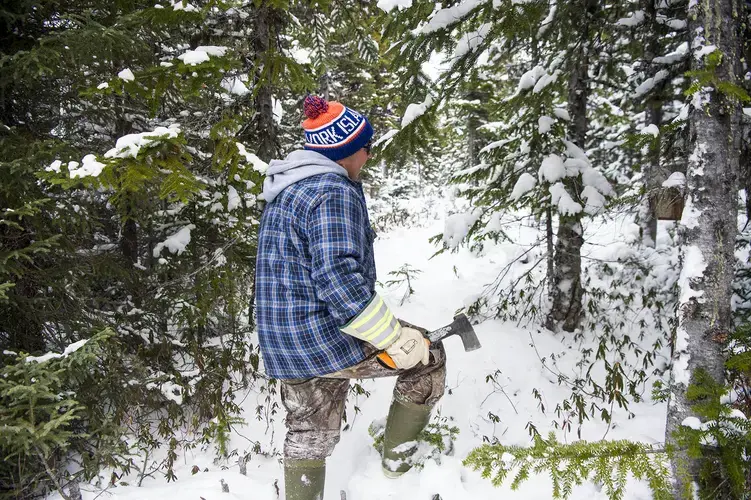 David Wolfrey checks on his martin trap on the outskirts of Rigolet. Image by Michael Seamans / The Weather Channel. Canada, 2019.