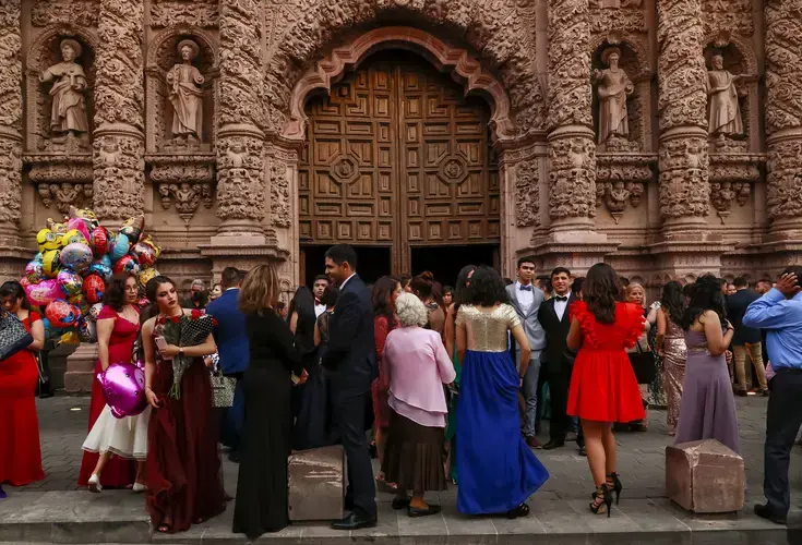 Families stream out of a graduation celebration at the Catedral Basílica de Zacatecas. Image by Erika Schultz. Mexico, 2019.