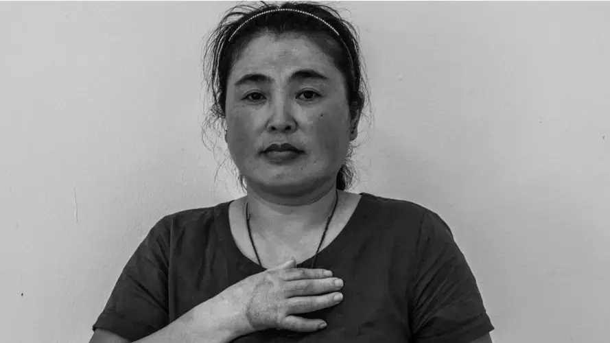 Noodle factory Xi Feng from China had only been in Singapore for 25 days when she was injured at work. The agency responsible for her refused to pay her back, she said. Image by Xyza Bacani. Singapore, 2017.