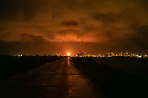 Clouds sit above Vidor at night.