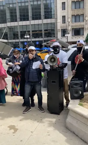 Imran speaks at a protest with the Rohingya and Burmese communities in Chicago