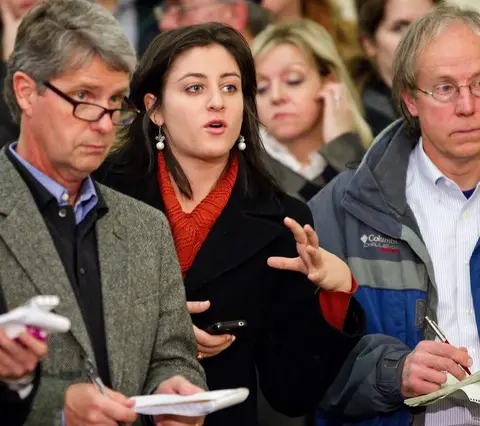 Reporter asks question during press conference