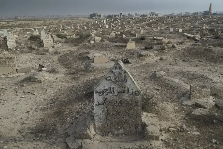 Cemetery destroyed by ISIS in Qayyarah town. Image courtesy of Wikimedia Commons. Iraq, 2016.