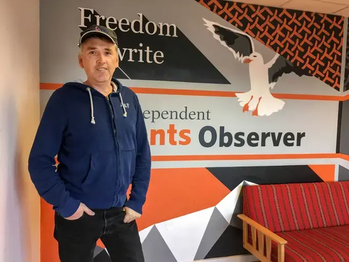 Journalist Thomas Nilsen poses for a photo in the offices of The Barents Observer in Kirkenes, Norway. The newspaper publishes in both English and Russian and covers environmental issues in the Russian Arctic. Nilsen recently found out he was no longer welcome in Russia and he's been fighting the decision in Russian courts. Image by Amy Martin. Norway, 2018.