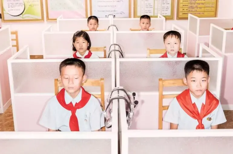 Students at the Pyongyang Orphans' Secondary School, which is housed in a new brick-and-steel complex. In a class of ten- and eleven-year-olds, one boy asked, 