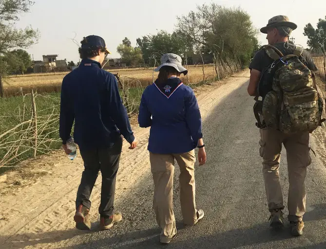 Chris Sherman, Miciah Thacker and Paul Salopek take the first steps of their two-day journey together in India. Image by Mark Schulte. India, 2018.