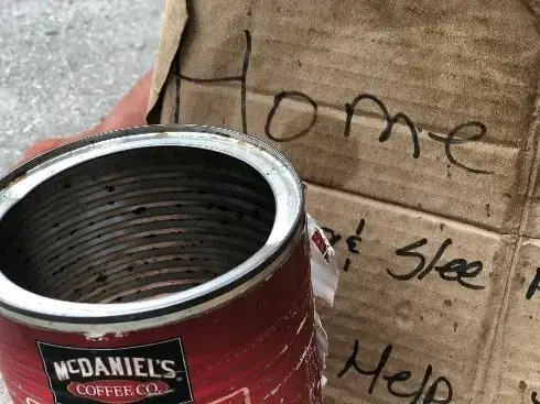 Ellen's sign and coffee can. Image by Reema Dhawan and Diego Madriz. United States, 2018.