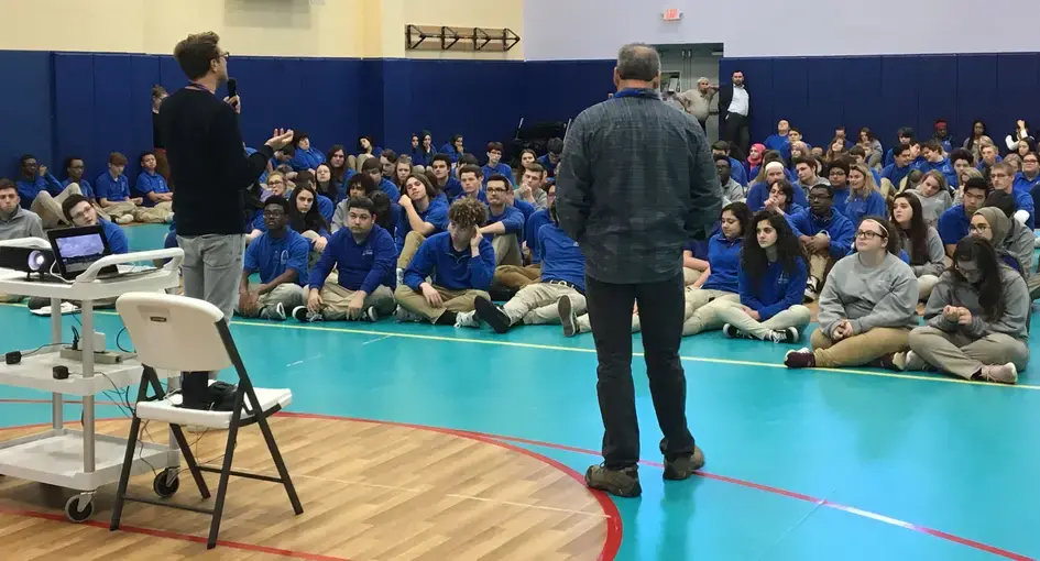 Jon Cohen and Carl Gierstorfer present to an all-school assembly at Gateway Science Academy