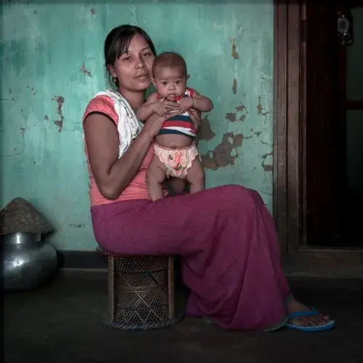 Sonia Khwairaakpam, 24 and Malem Koirapam, four months. Thanga Tongbram Leikai, Manipur Three weeks after Sonia Khwairaakpam gave birth to her son Malem, heavy rains flooded her home compelling her family to move out of their home. Hydrological changes from the construction of the Ithai Dam along with climate change have resulted in severe flooding that has never been seen before around the periphery of Loktak Lake. 