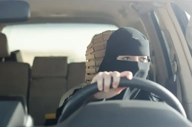 Woman driving in Saudi Arabia. Image by Shutterstock. Saudi Arabia, 2018.