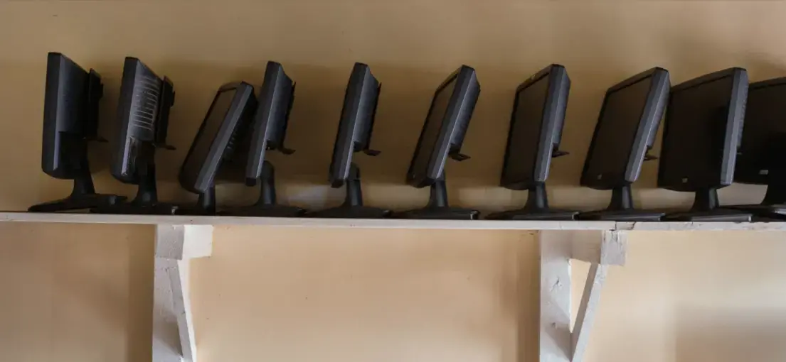 Computers in the unused Kibera Soweto East Resource Centre, a clinic and computer center in Kibera, Nairobi. The clinic is a UN-Habitat project, but they did not respond to inquiries. Image by Peter DiCampo. Kenya, 2018.