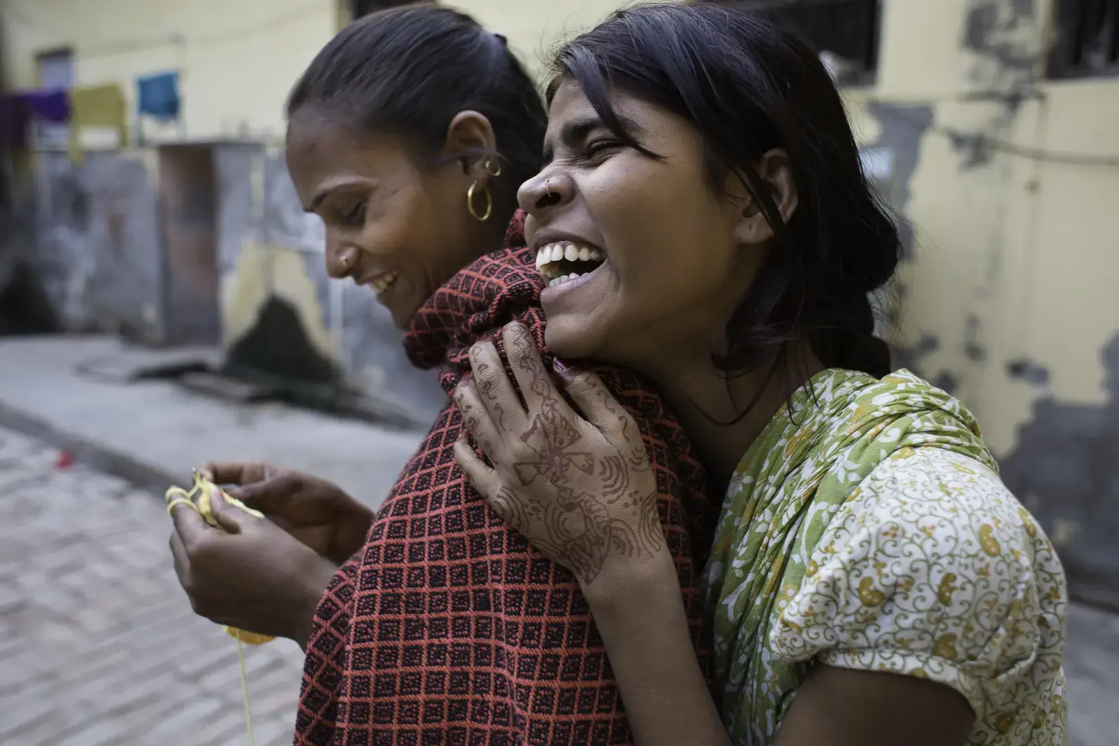 Two friends laugh together