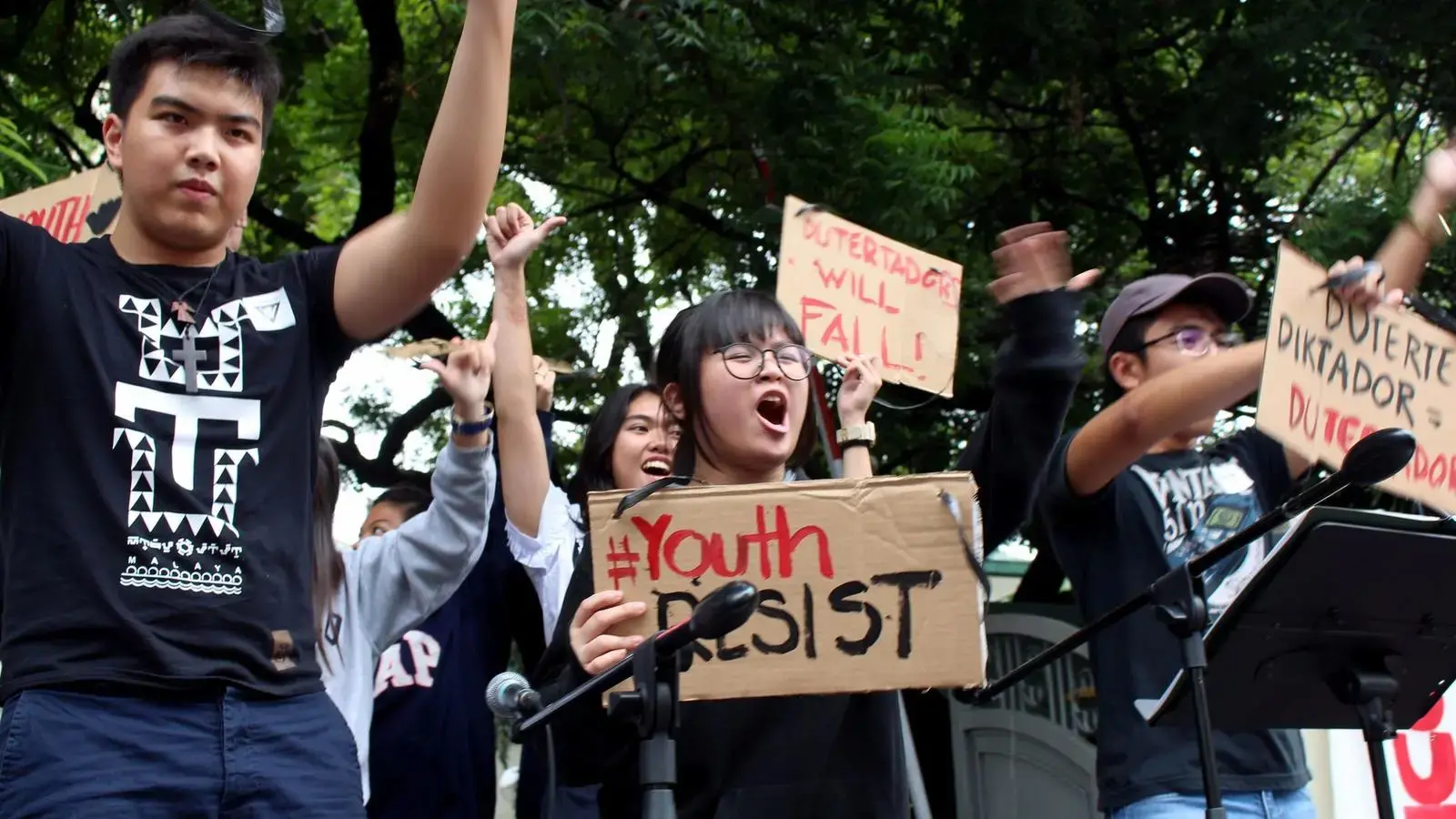 Shibby de Guzman, 13, center, joins other youths Tuesday at a Manila rally to protest policies of the Duterte government. Image by Ana P. Santos. Philippines, 2017. Shibby de Guzman, 13, center, joins other youths Tuesday at a Manila rally to protest policies of the Duterte government. Image by Ana P. Santos. Philippines, 2017.