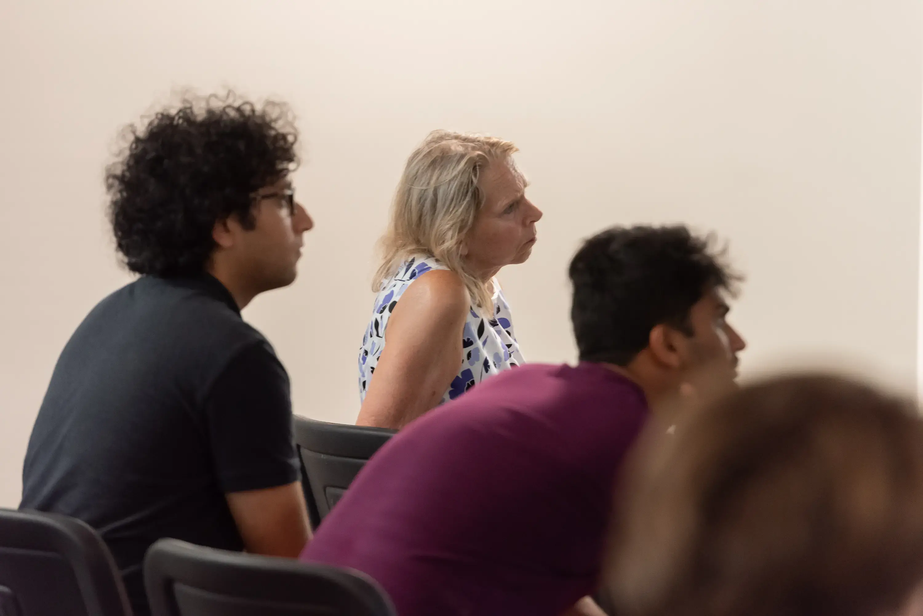 Audience members listen closely to Q&A session.