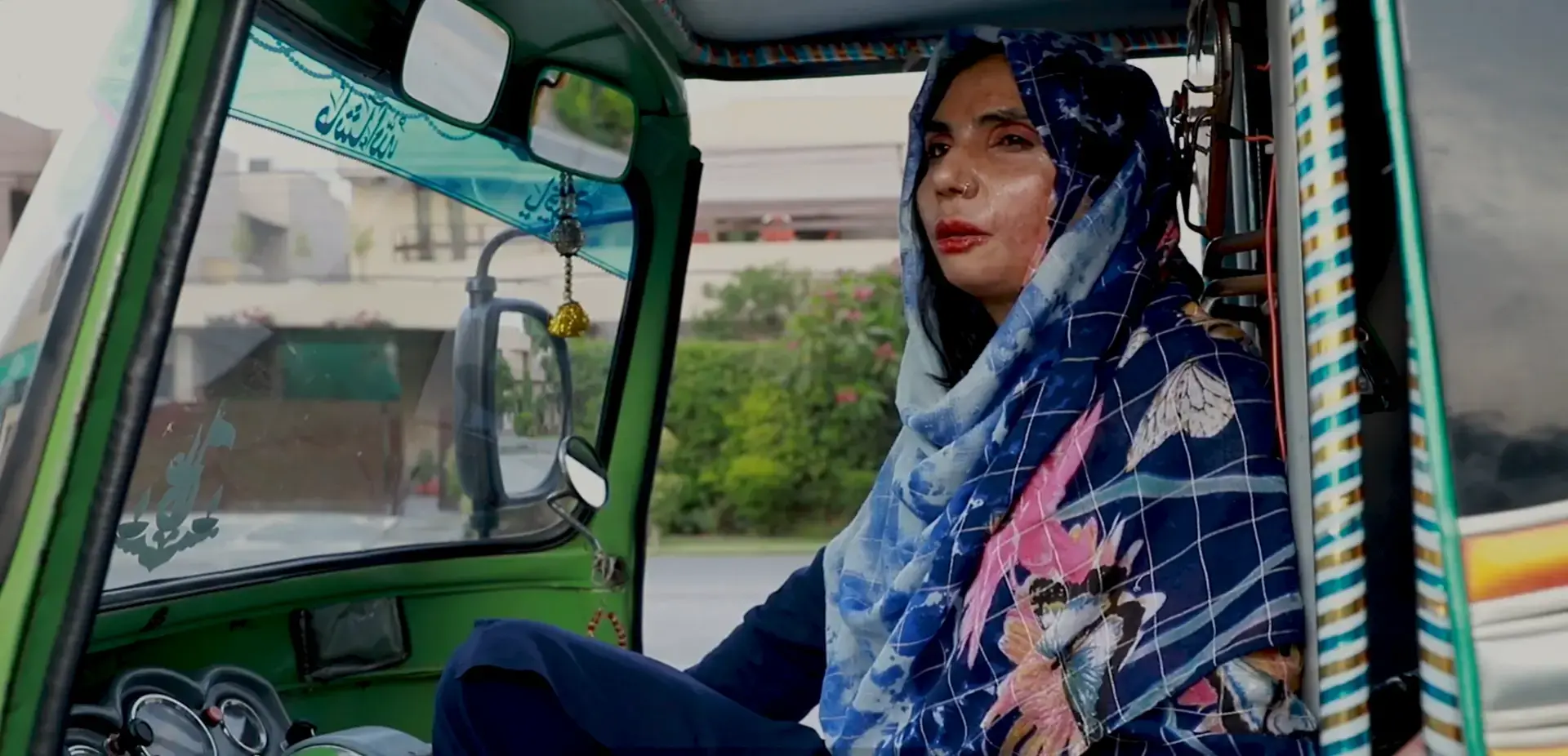 Acid attack1 A women in the driver's seat in a rickshaw