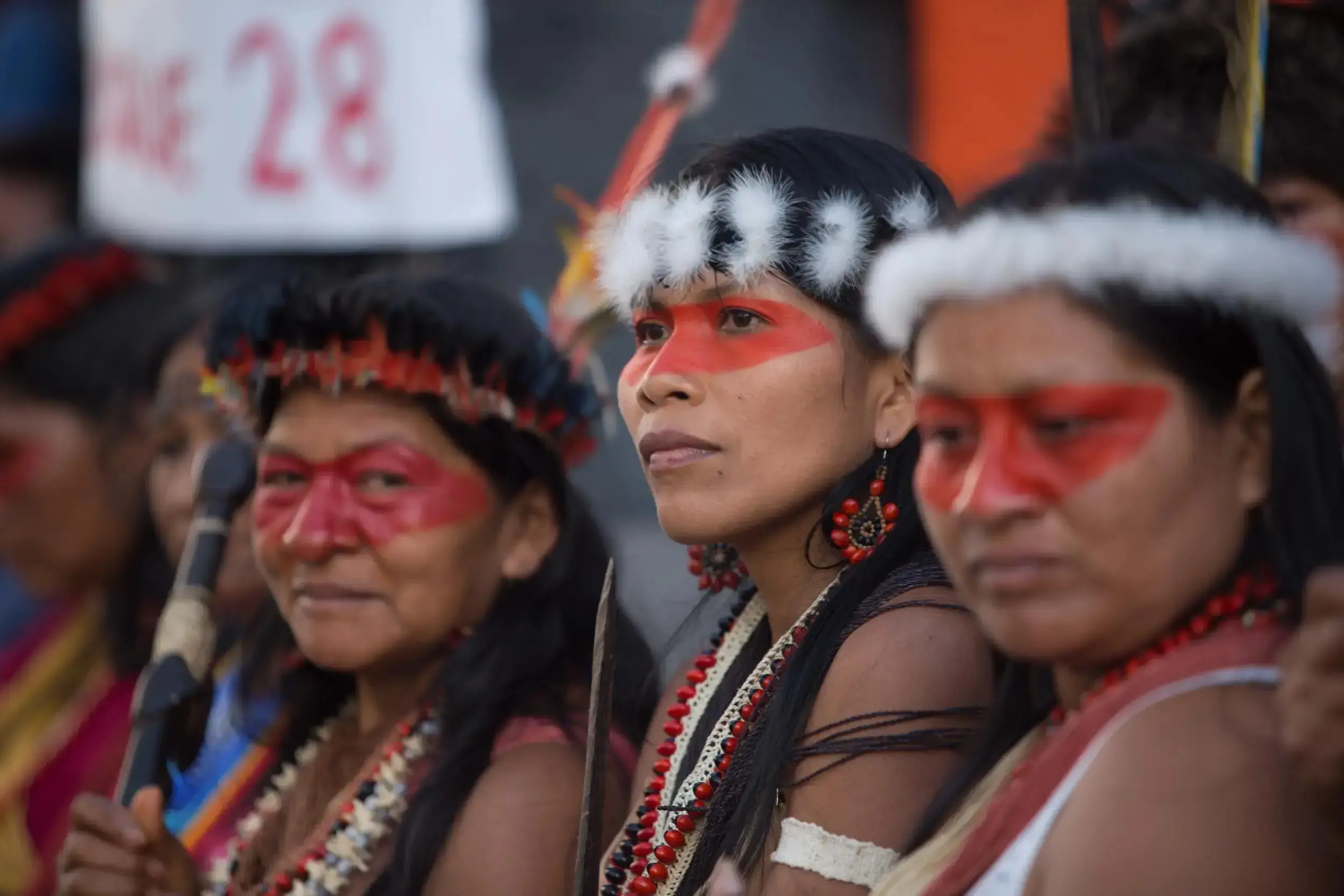 Indigenous rights activist Nemonte Nenquimo (center) is a Waorani woman who led the legal process that suspended the oil exploitation that threatened her community in Pastaza