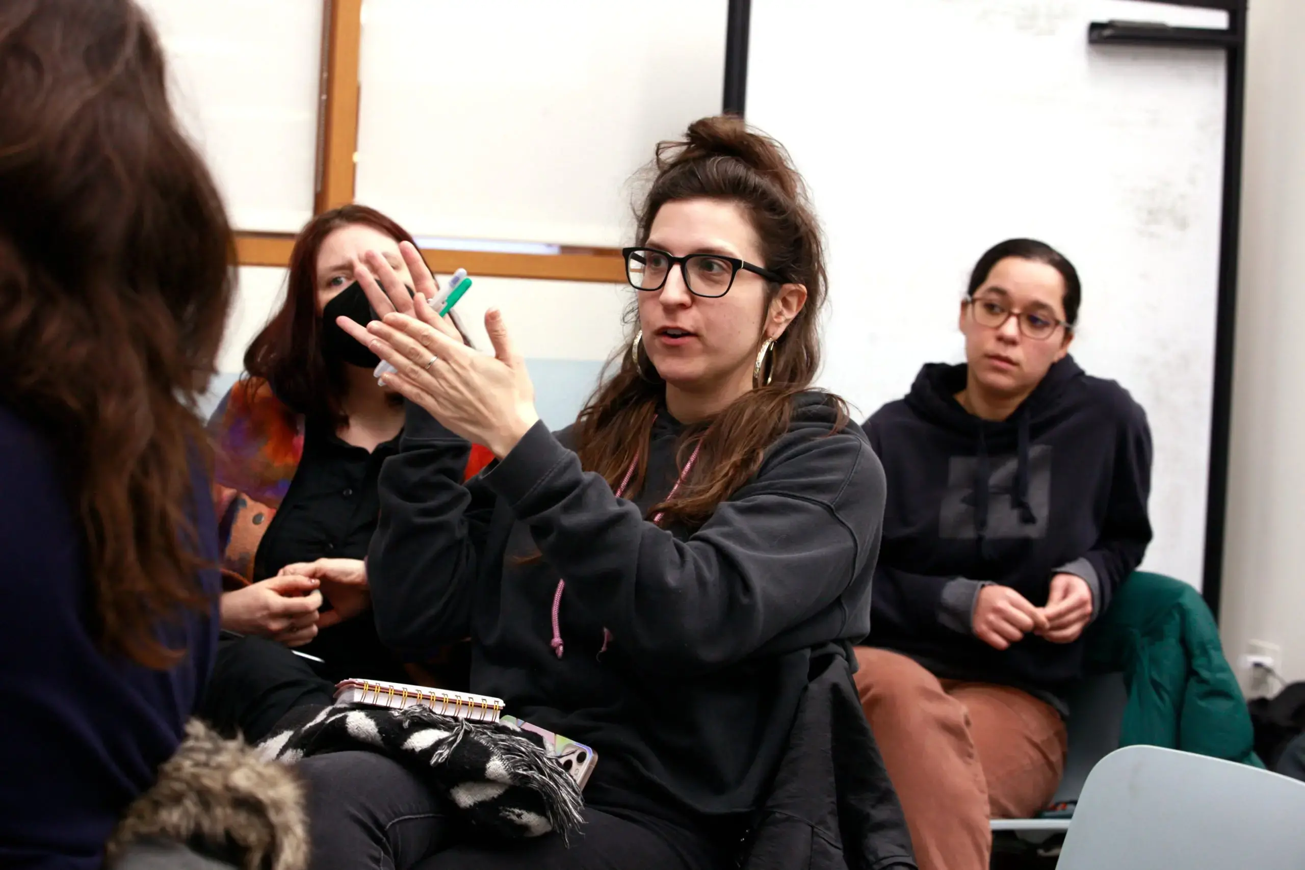 People speak at a town hall meeting