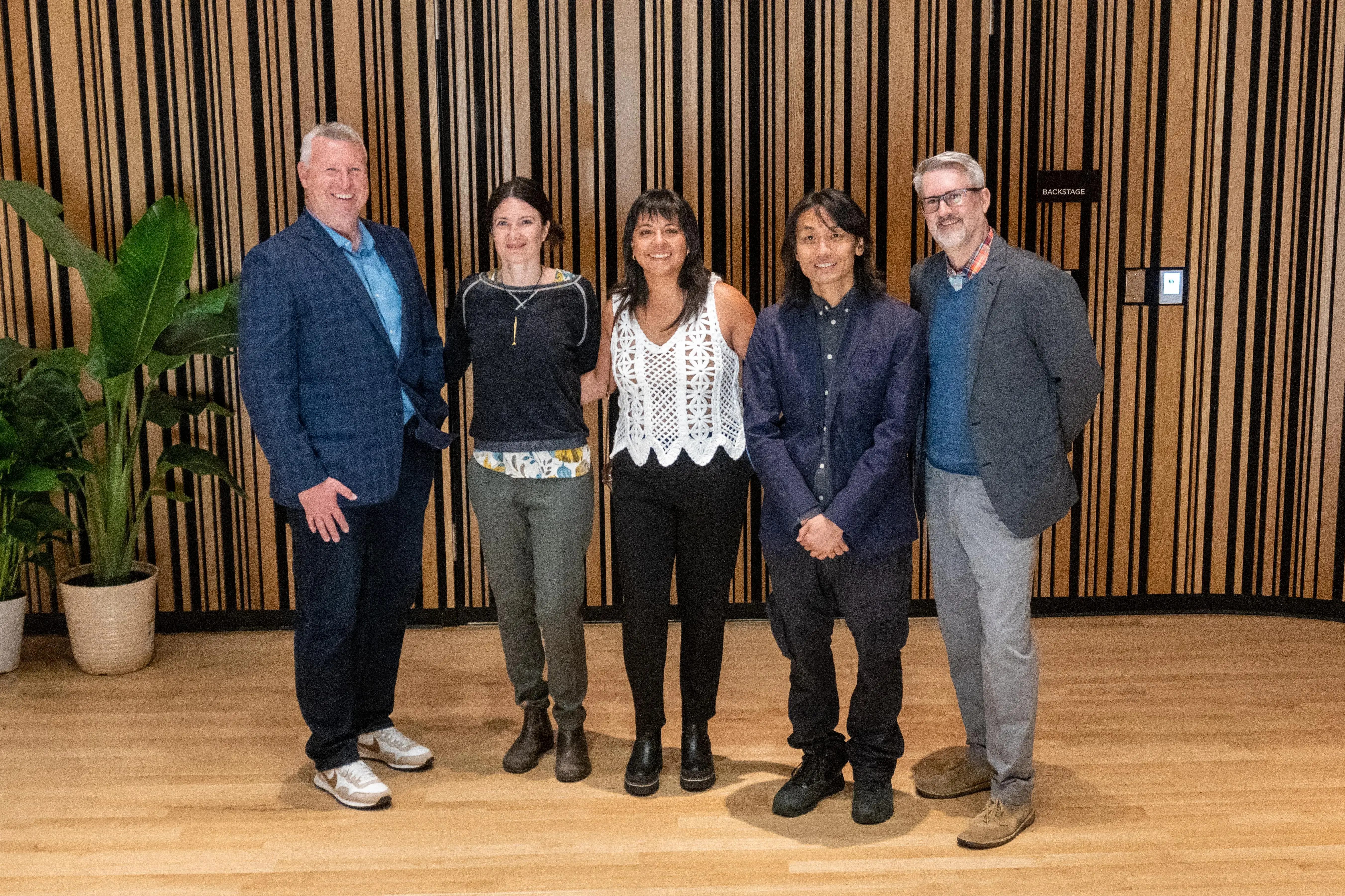 The panelists pose for a group photo