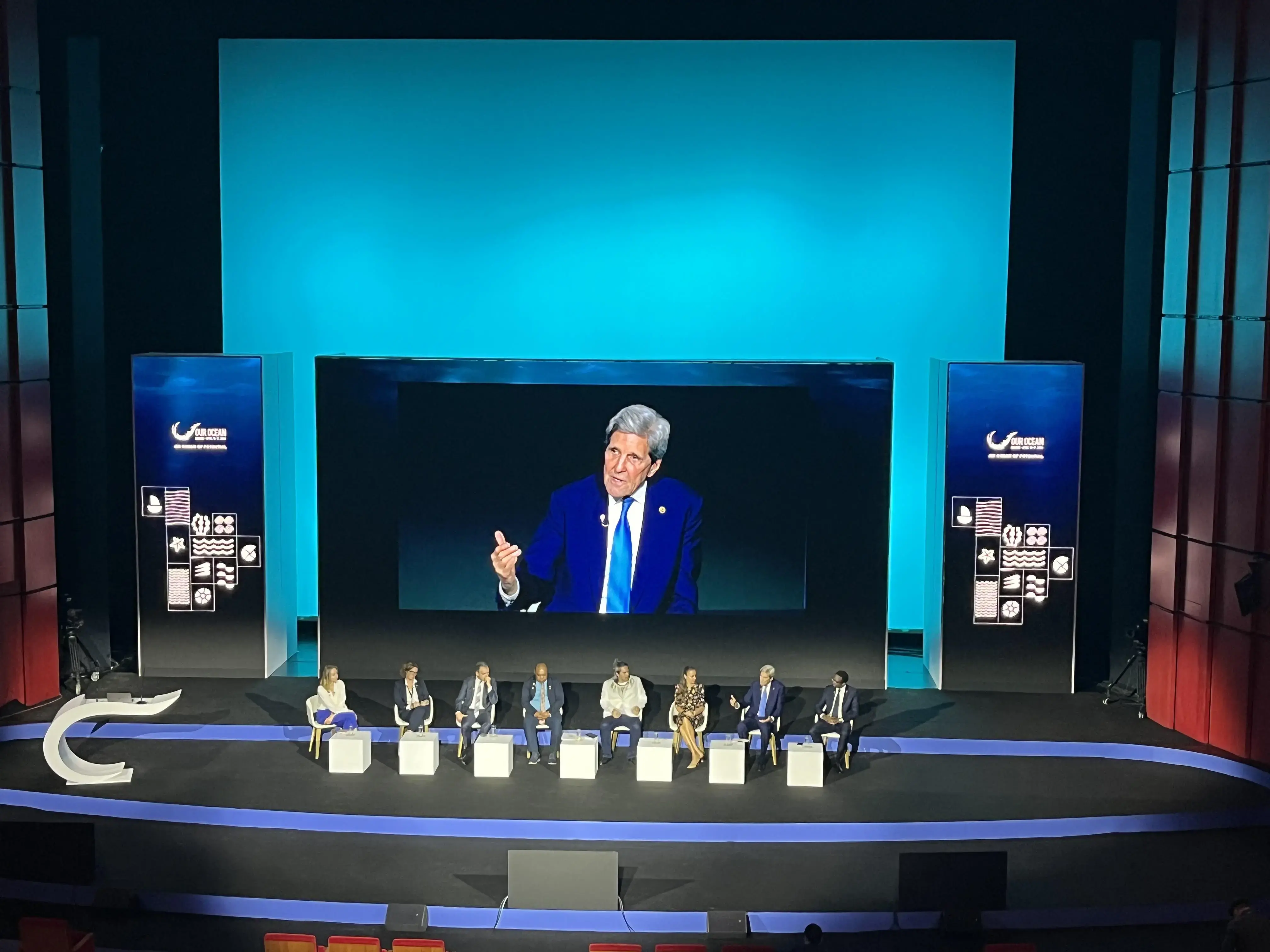 Panelists on stage in Athens