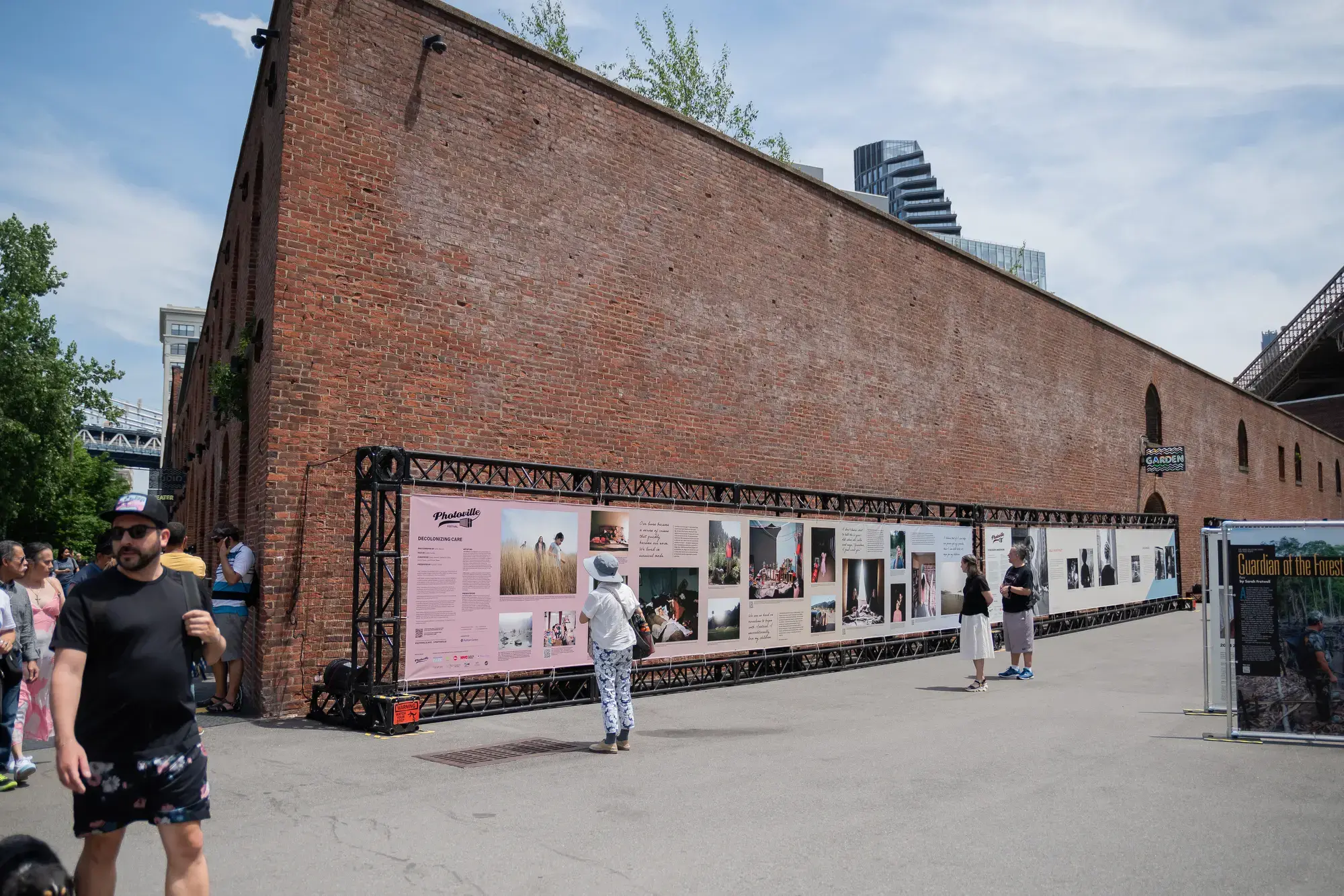 Visitors engage with Pulitzer Center-produced photography exhibit “Decolonizing Care"