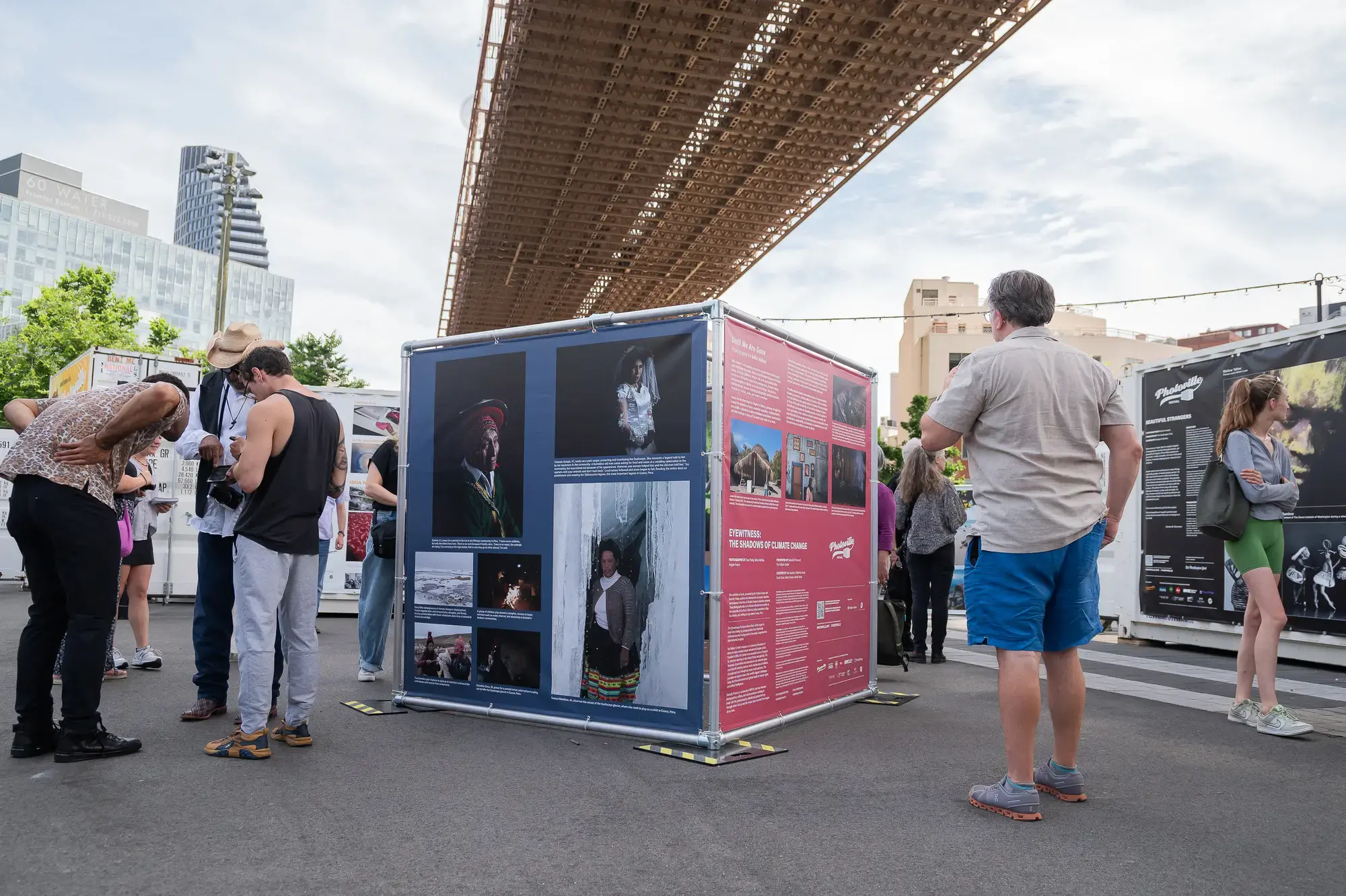 A view of the Pulitzer Center and Diversify Photo-produced exhibit, “Eyewitness: The Shadows of Climate Change,” during Photoville opening weekend. Image by Daniel Vasta. United States, 2024.