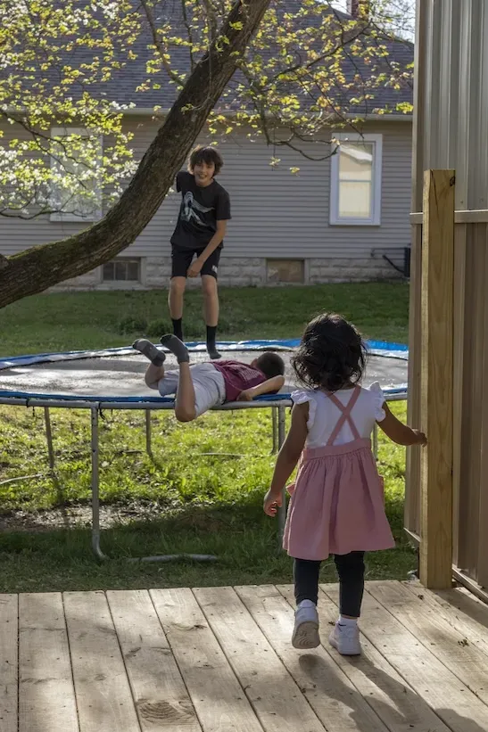 Kids play on a trampoline