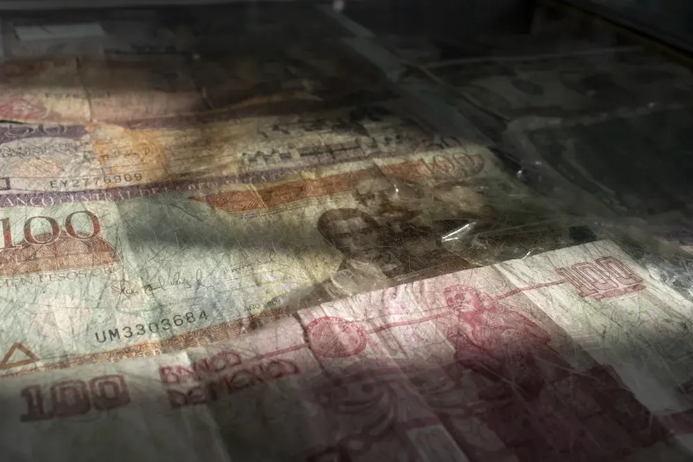 Foreign print money under a pane of glass