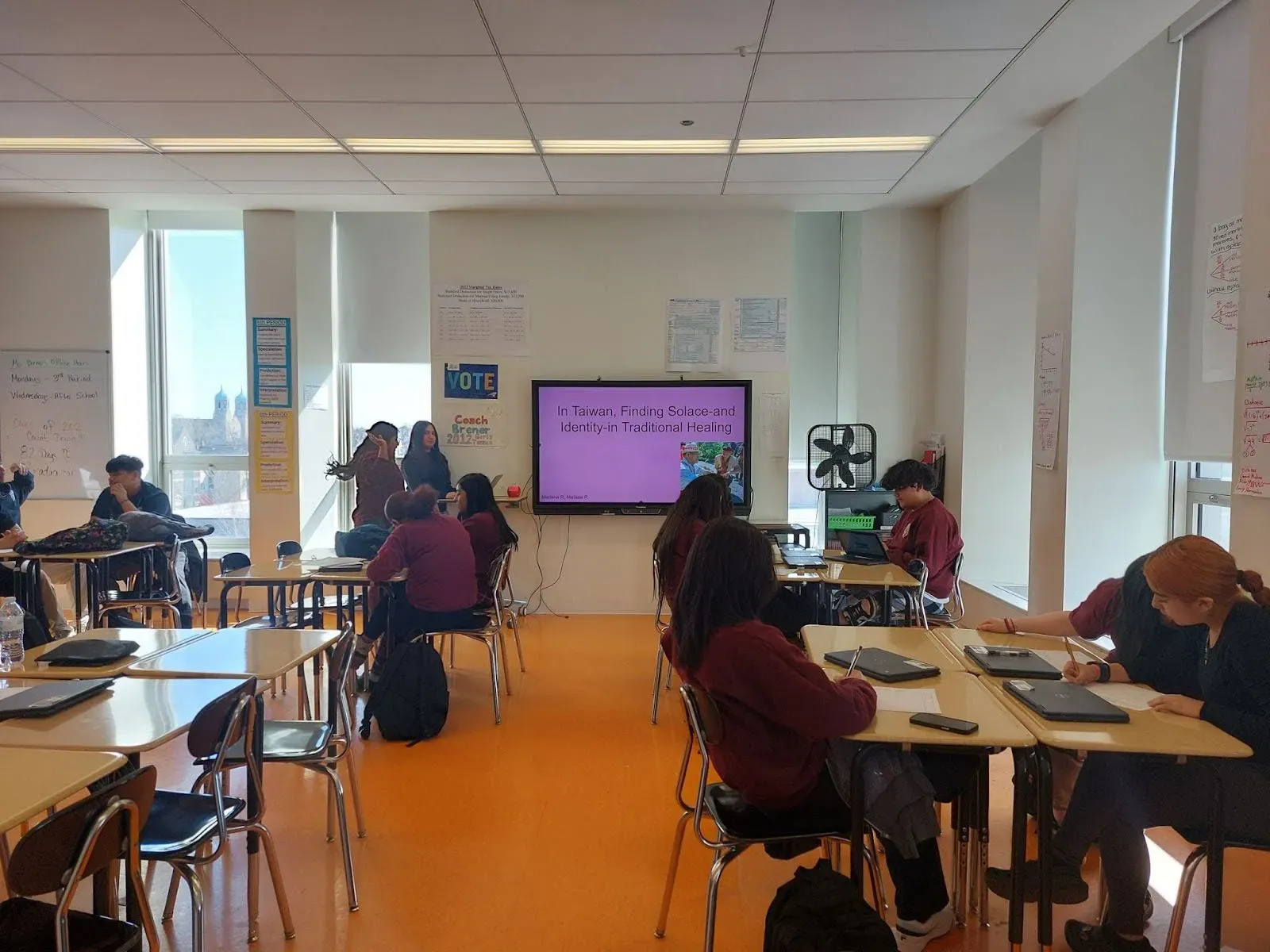 Students work in a classroom in small groups