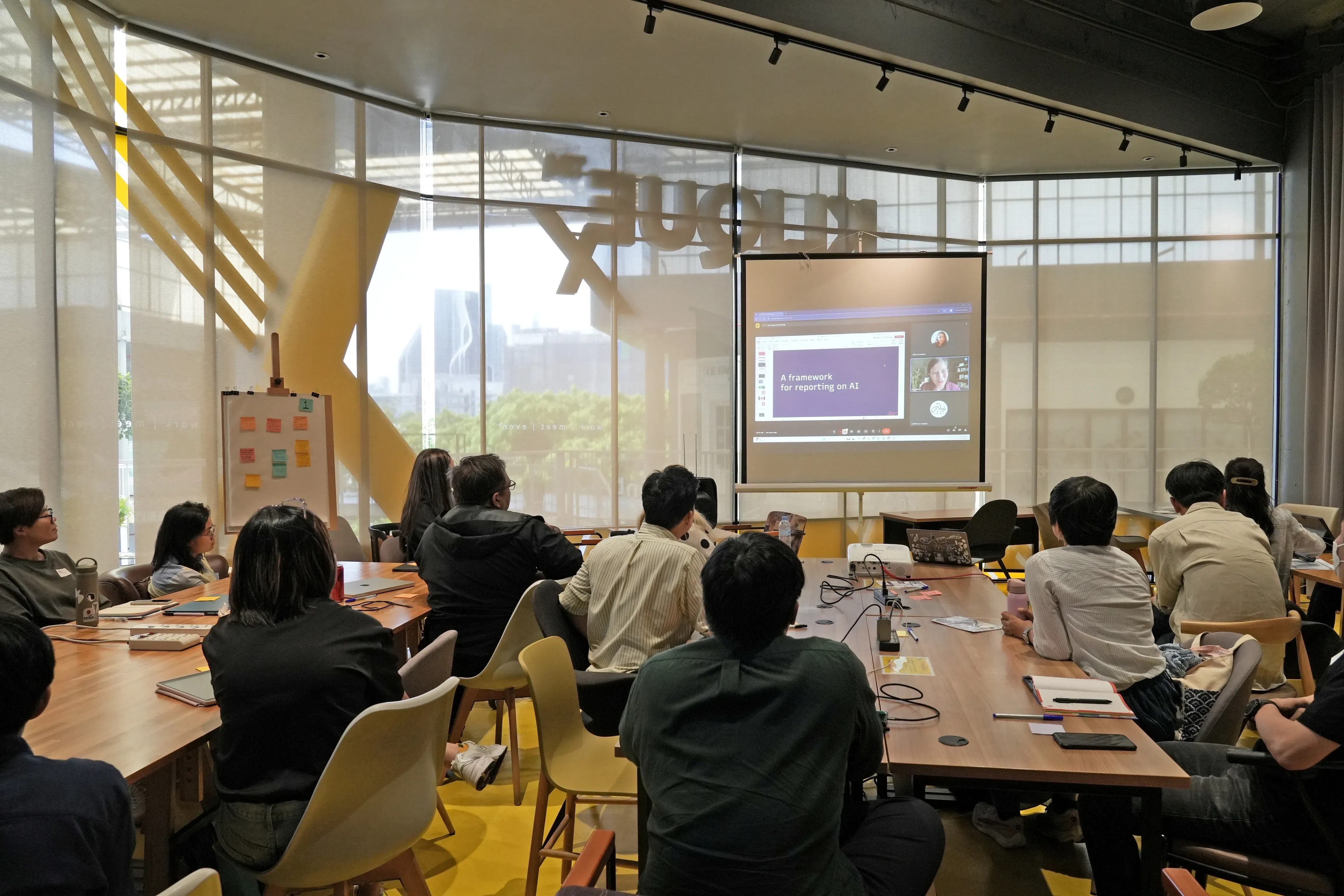 event attendees listen to a presentation through Zoom