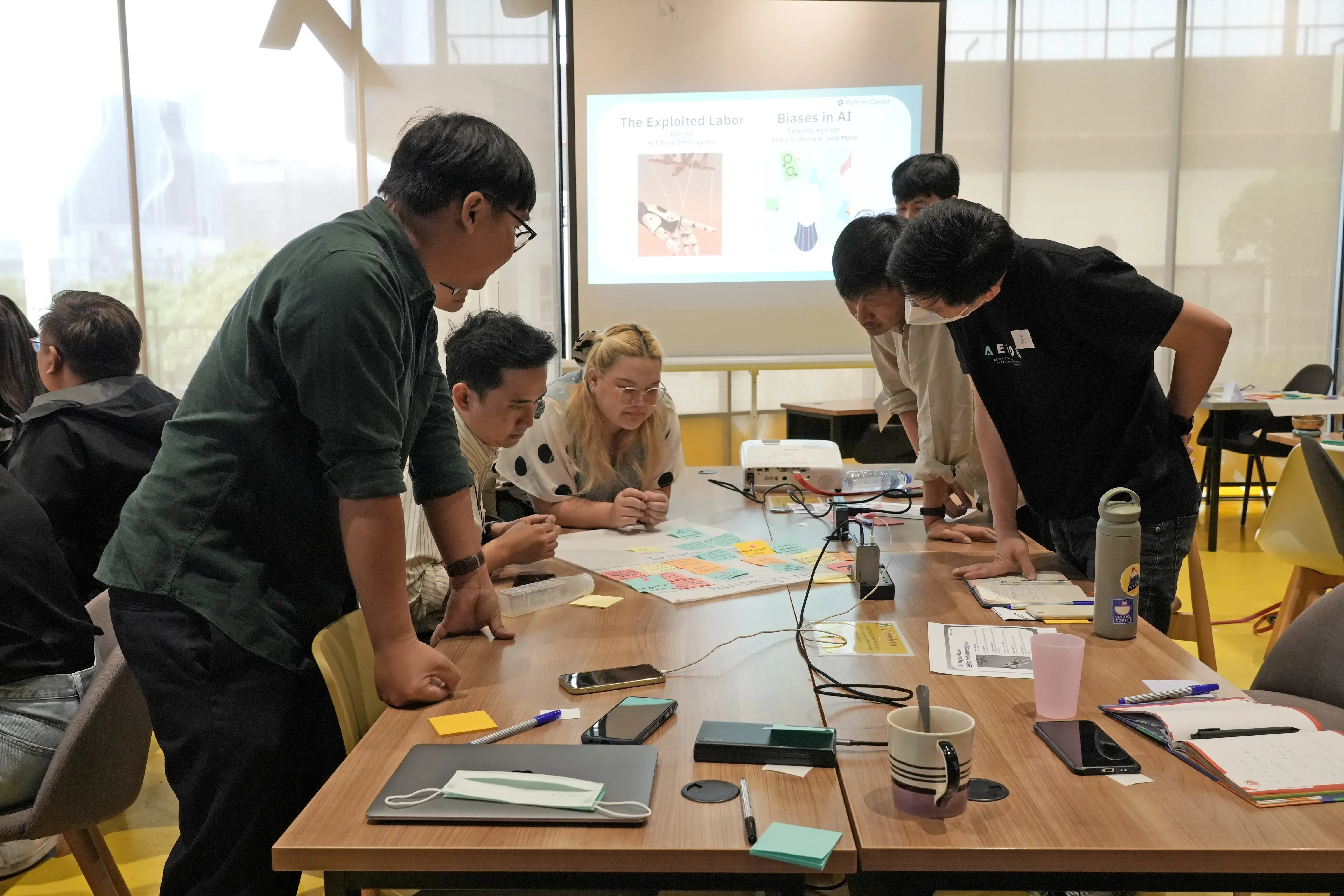 event partipants work together on a brainstorming activity with sticky notes