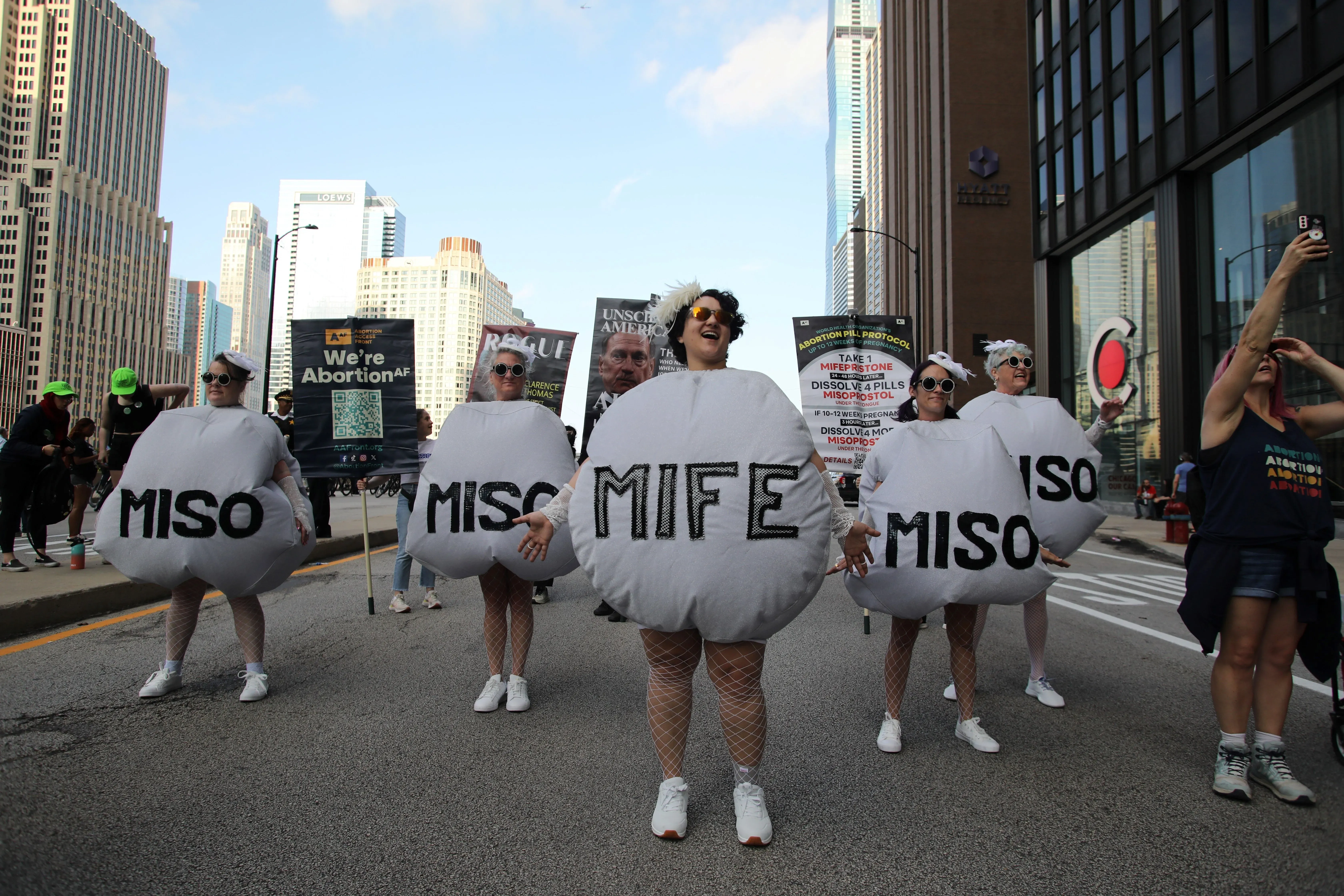 Chicago, Il, USA - Aug. 18, 2024: Pro-choice demonstrators promote accessibility to abortion pills on the evening before the start of the Democratic National Convention.