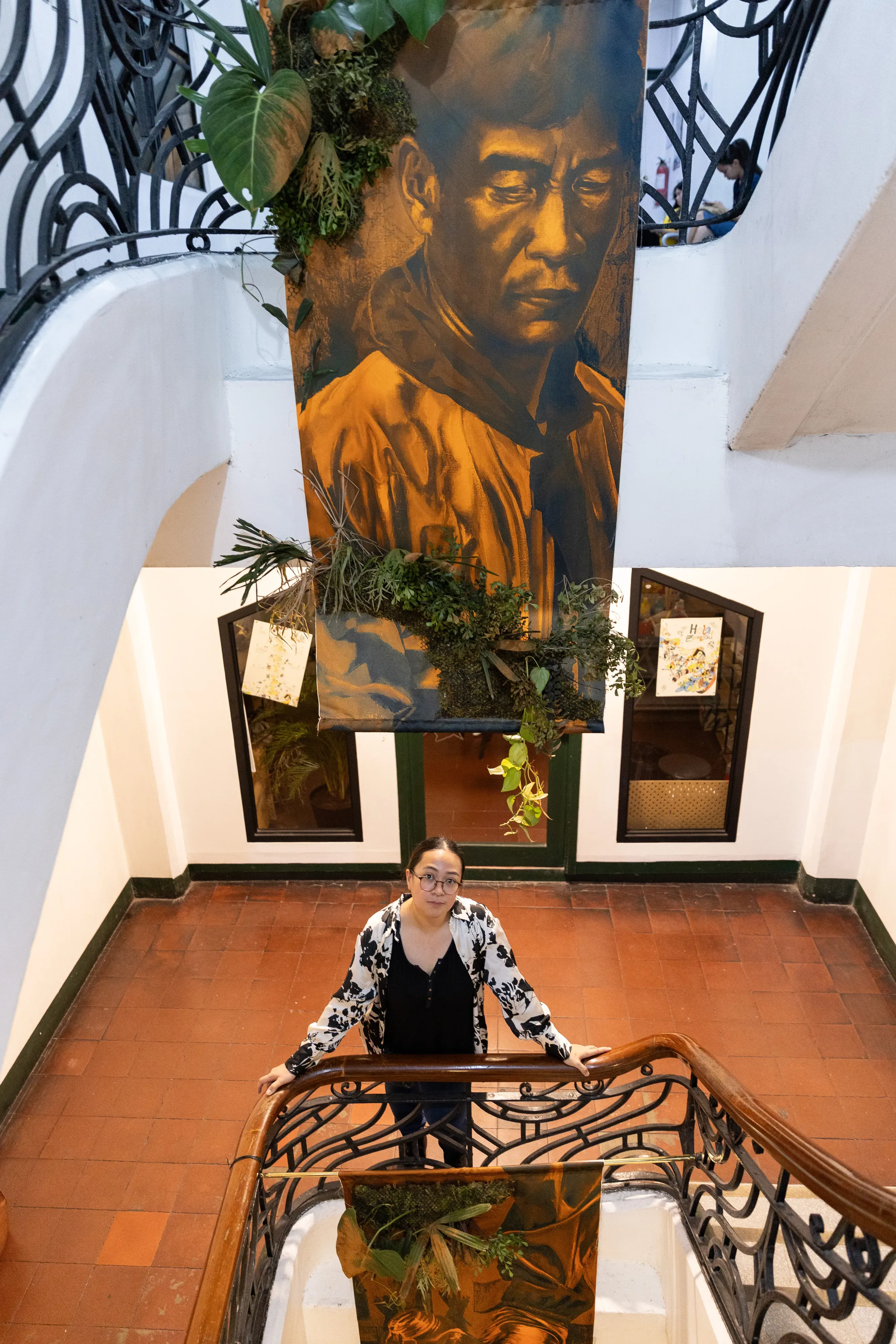 Kookoo Ramos-Cruda with her work, “Anino ng Kasagsagan.”
