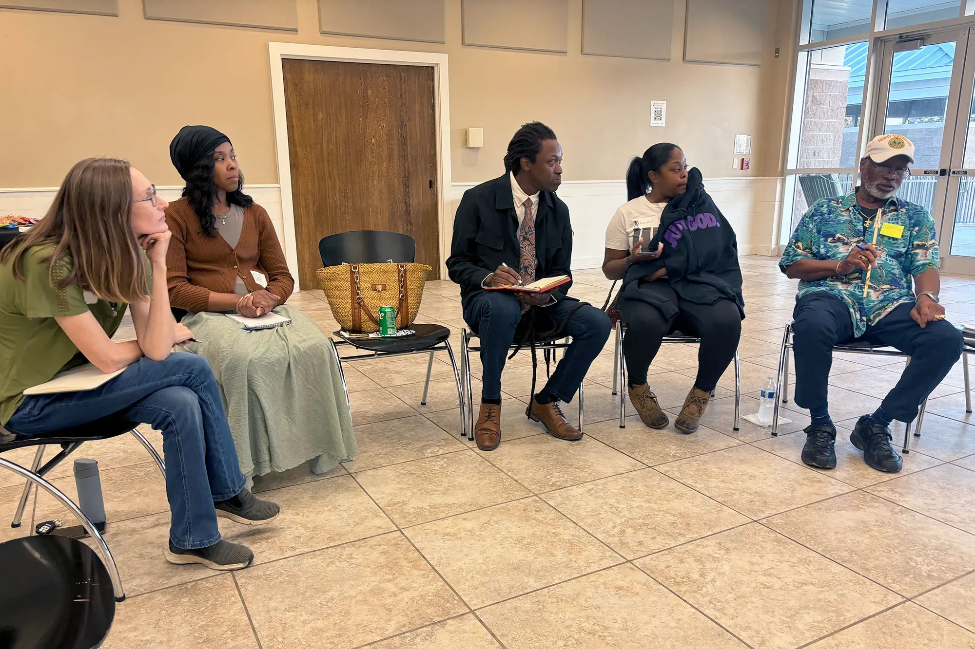people sit in a circle at a Mississippi Free Press event