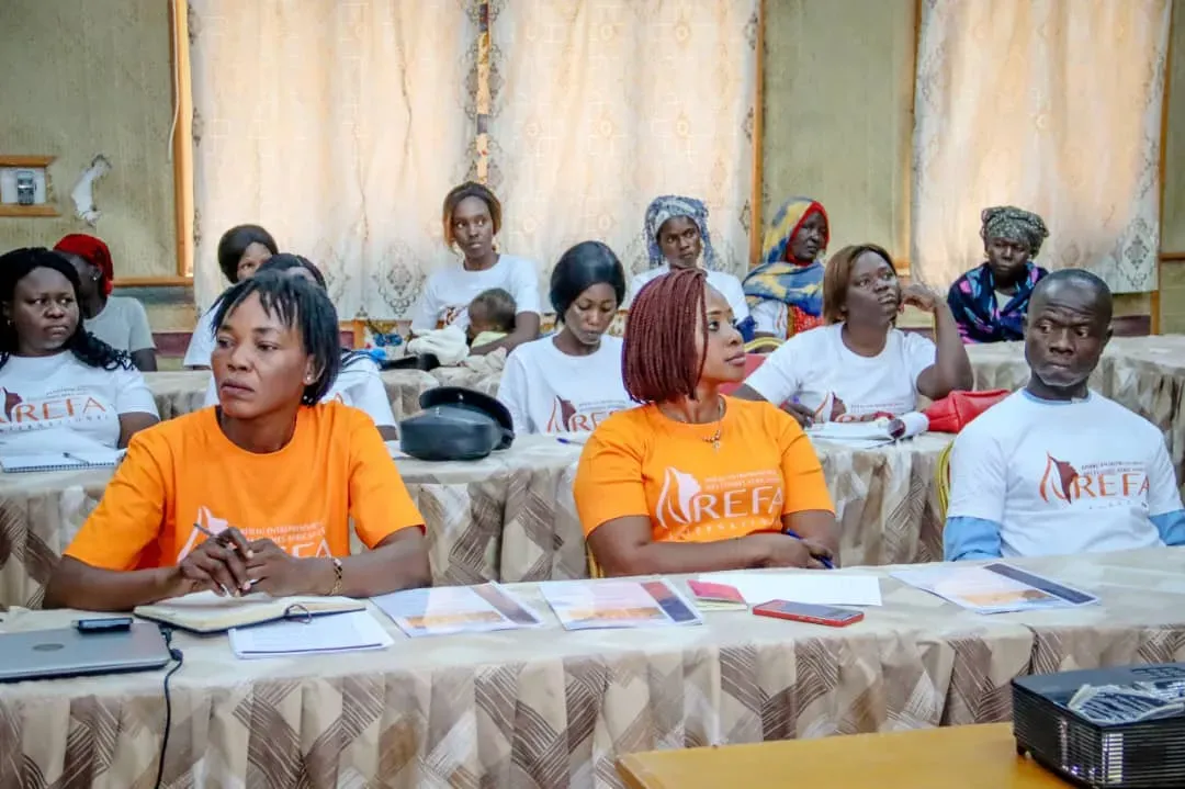 women talk at a workshop for women entrepreneurs