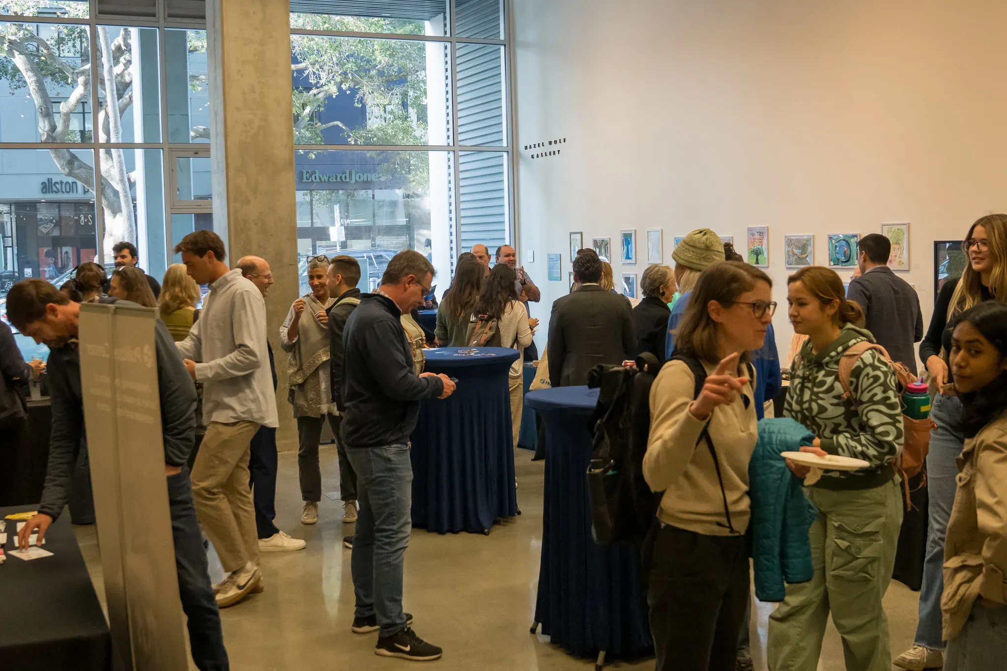 Audience mingles at gallery.