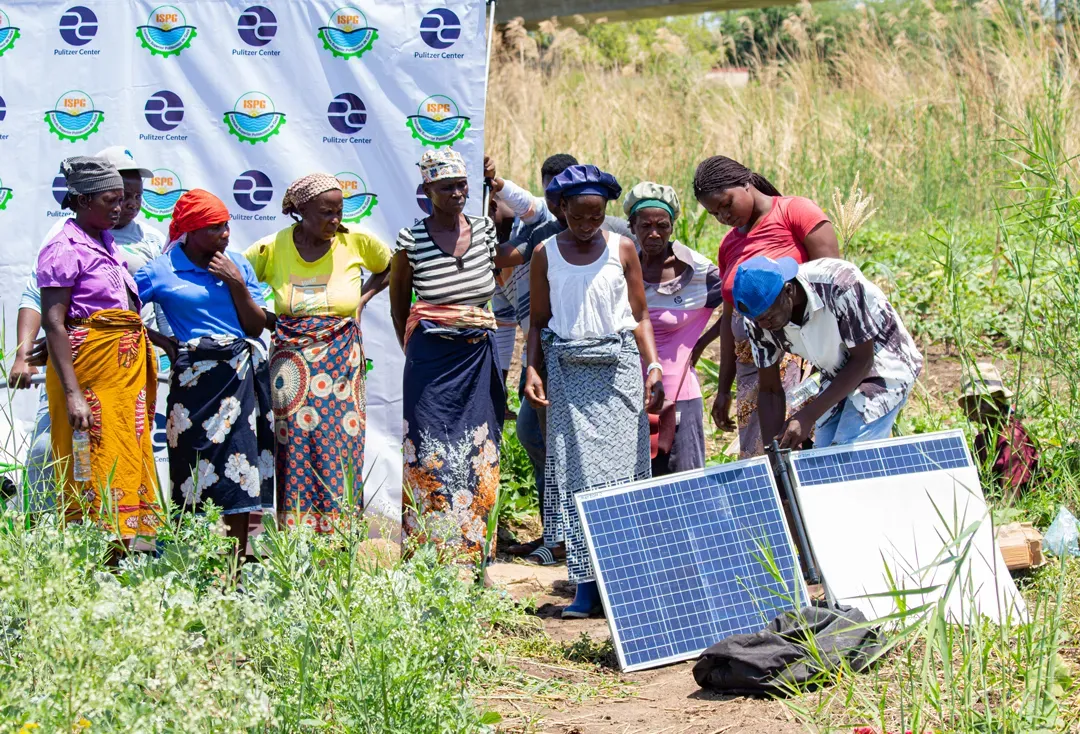 people at an event with solar panels