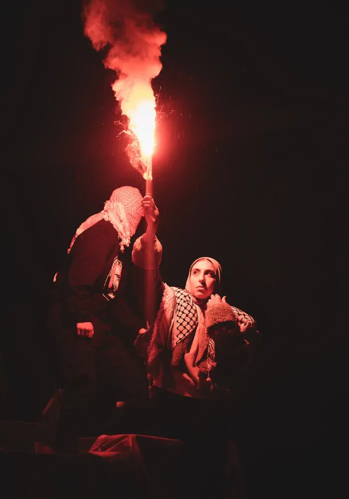 A woman illuminated by a spark