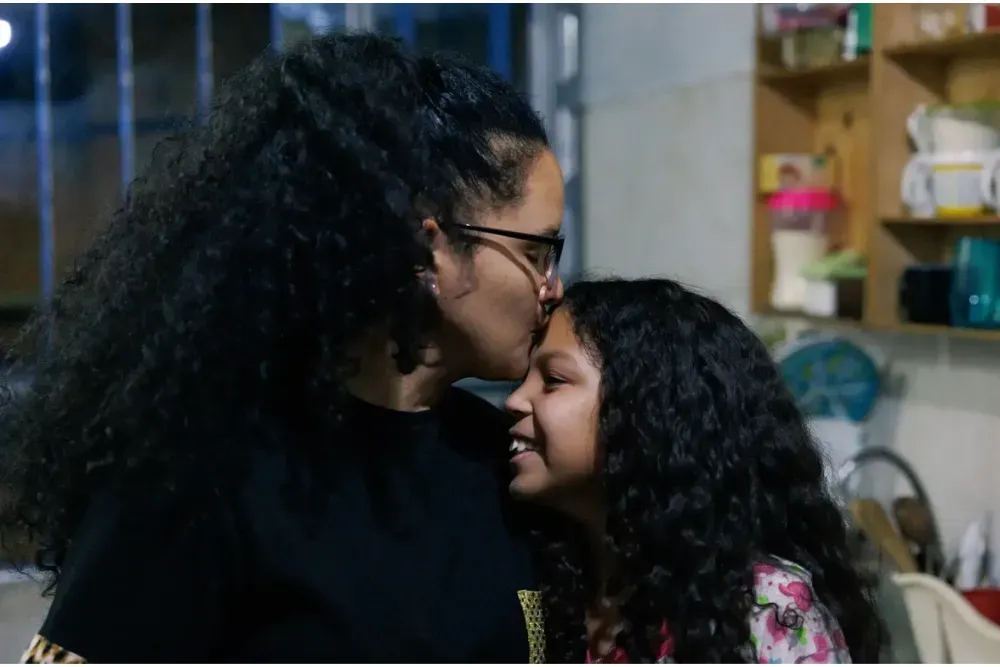 Zoheny Lugo and her daughter in their kitchen in Palmitas