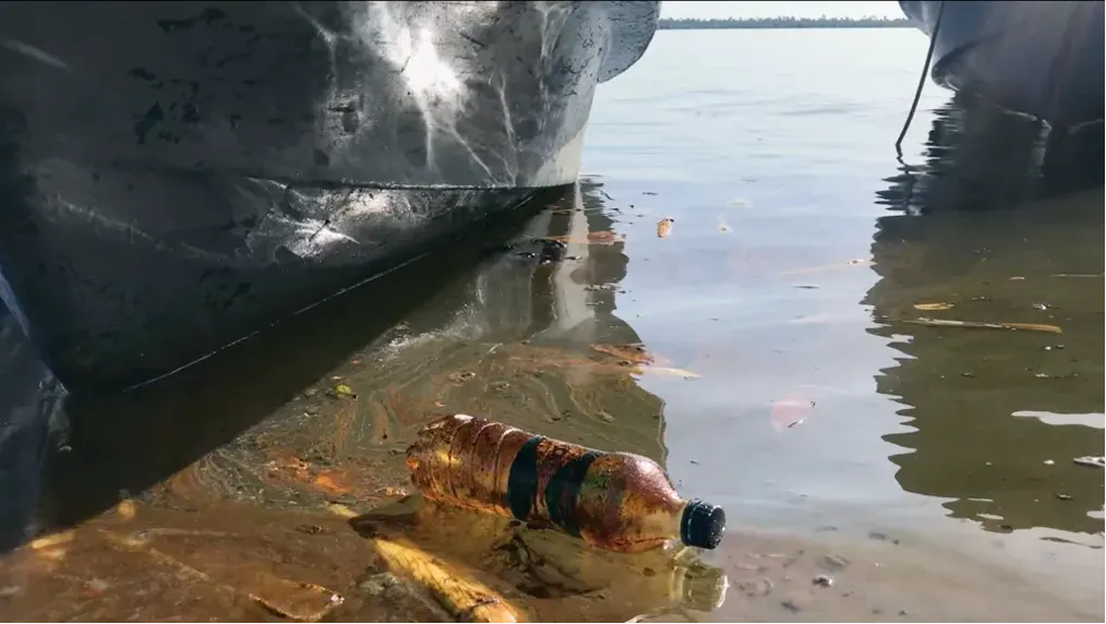 Trash floating in water