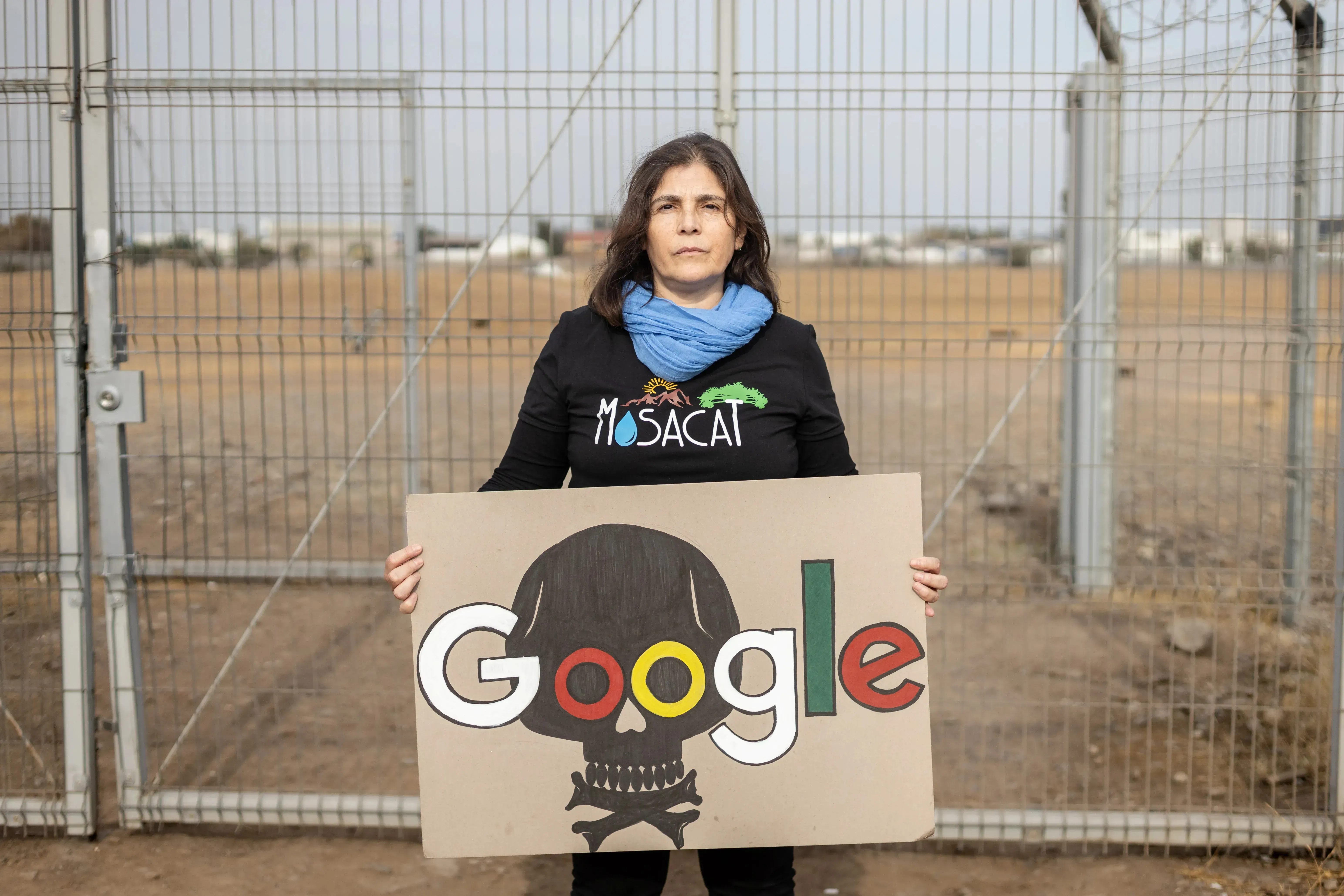 Tania Rodríguez, one of the spokespersons for the Mosacat collective, poses in front of the lot owned by Google in the municipality of Cerrillos, Santiago, Chile. Image by Sofia Yanjari. Chile, 2025.