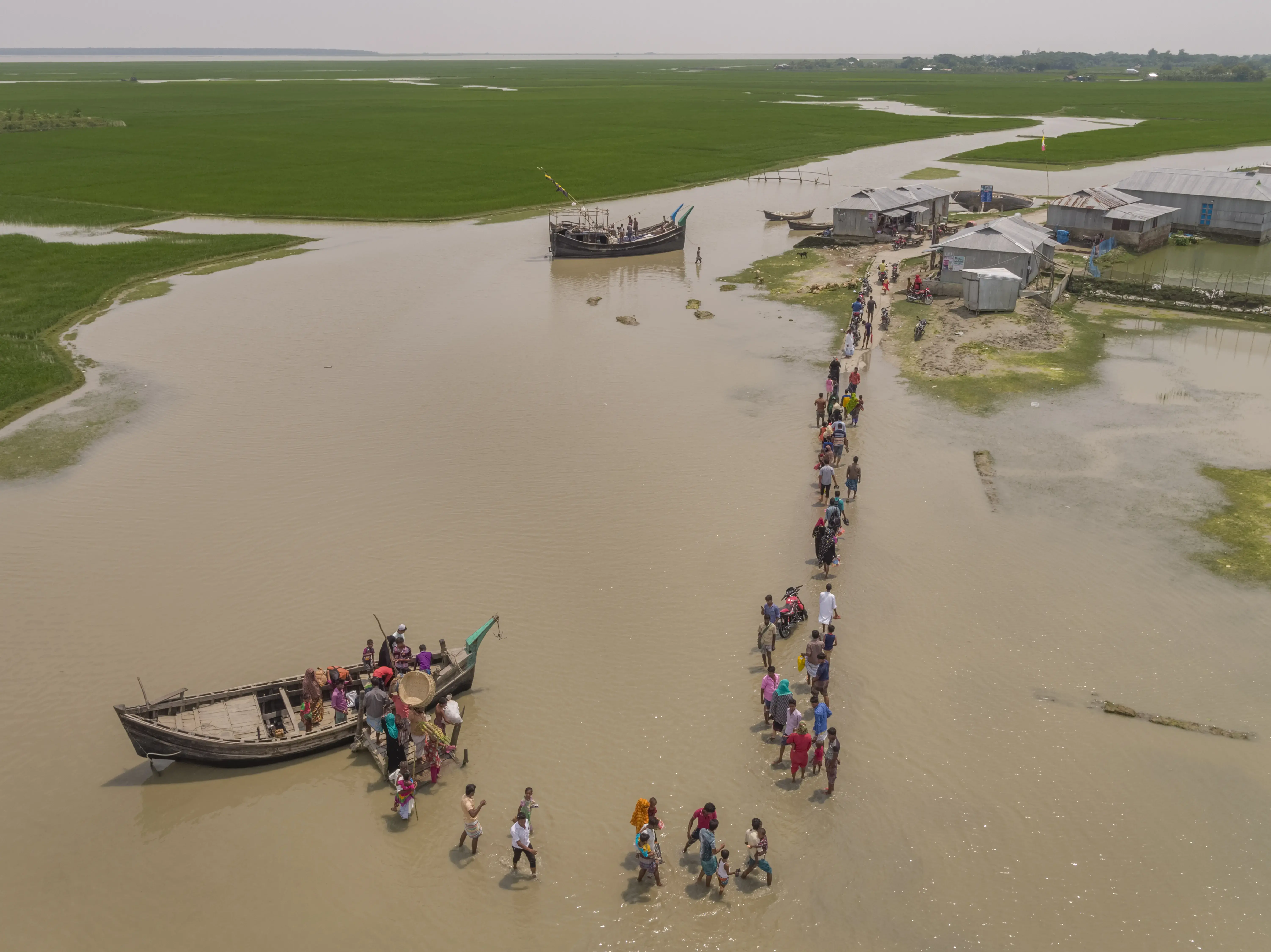 Last year’s monsoons, which typically run from June through September, were the worst in 40 years, and more than eight million Bangladeshis were affected by the devastation. At least 145 people died, an estimated 307,000 people were forced into emergency shelters, 700,000 homes were damaged or destroyed and about a third of Bangladesh was submerged. Areas along the Bay of Bengal, long prone to chronic flooding, have become increasingly uninhabitable. Scientists believe that a sharp rise in the bay’s surface temperature is why Bangladesh has suffered some of the fastest sea-level rises in the world. Some project a five-foot rise by 2100, which could displace 50 million people. Image by George Steinmetz. Bangladesh, 2017. Media file: 5_bangladesh_01_copy.jpg