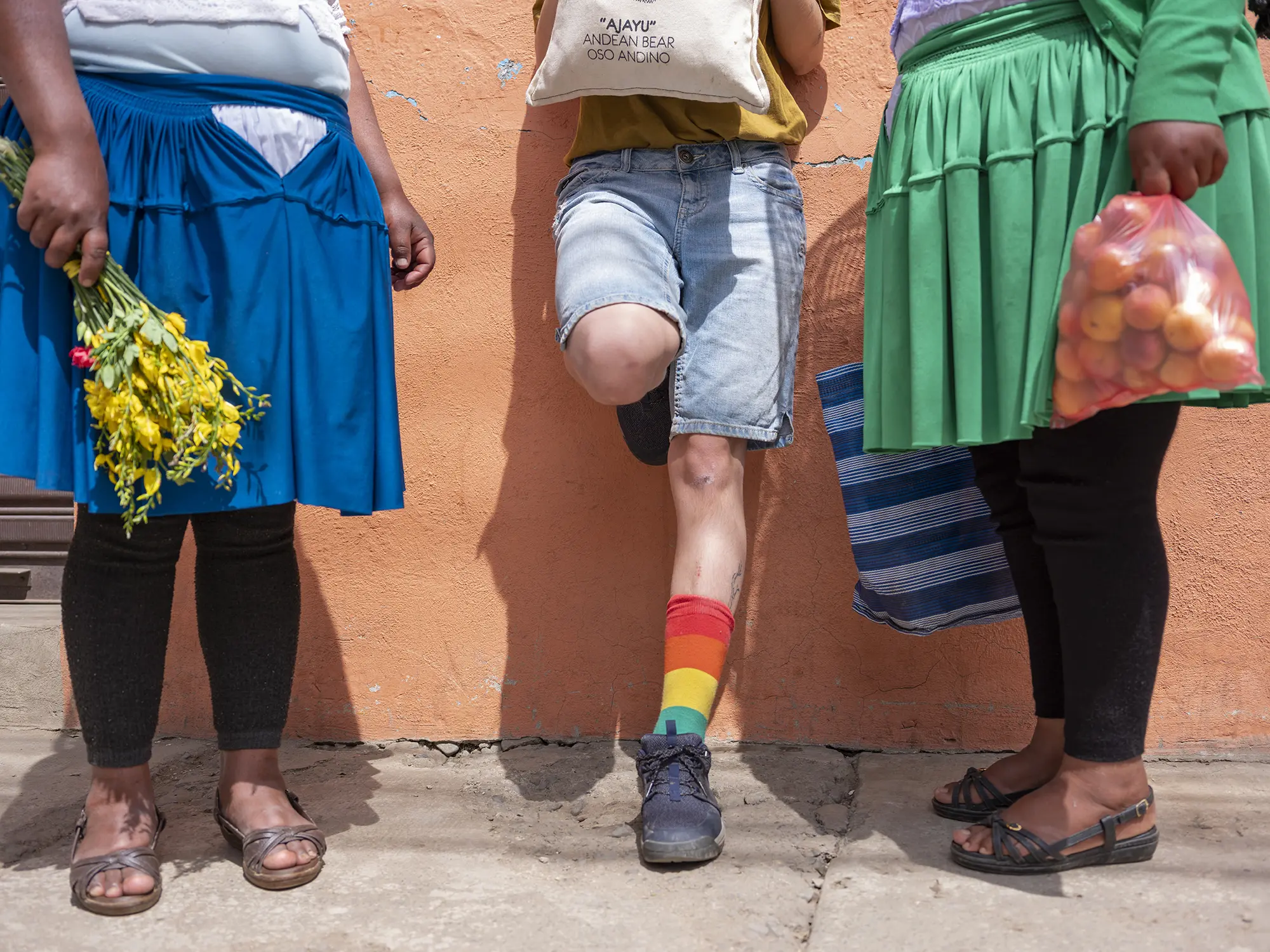 Three people stand next to each other