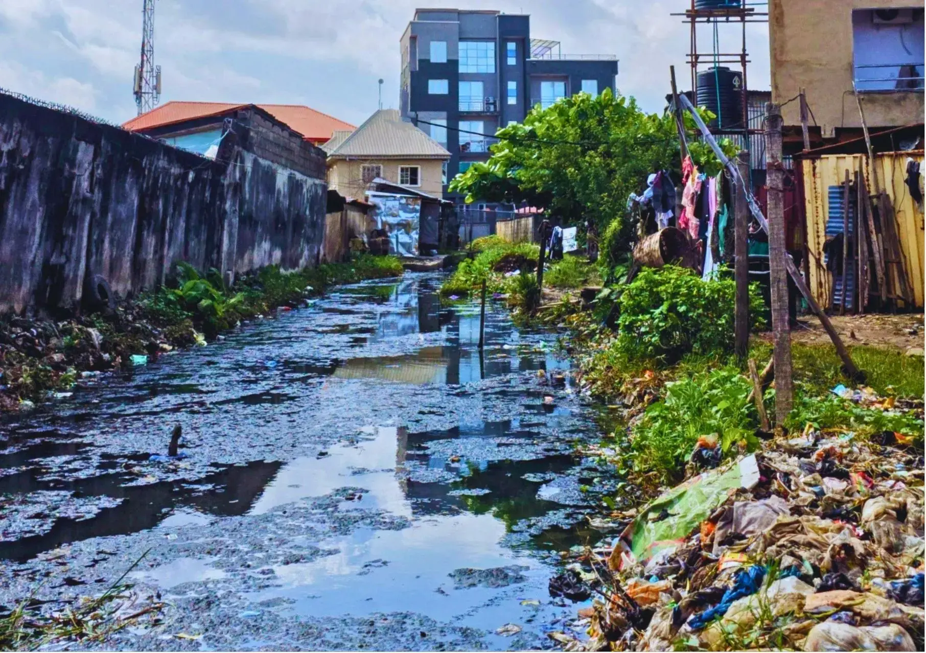 Canal turned into a refuse dumping site because of its proximity to residential homes, Lagos, Nigeria, 2023.