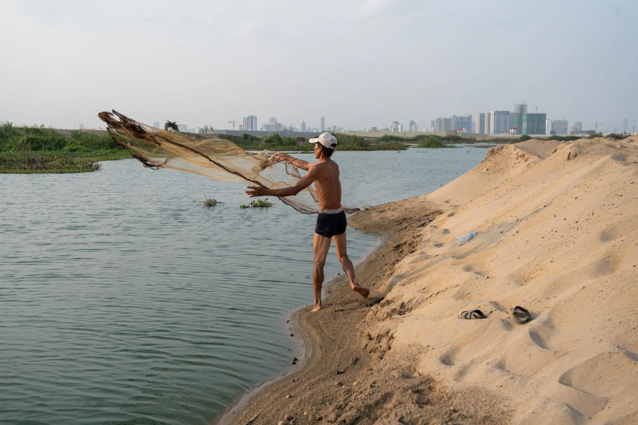 Fishing Tour Cambodia along the road of Khan Sen Sok in Phnom Penh city,  Cambodia 