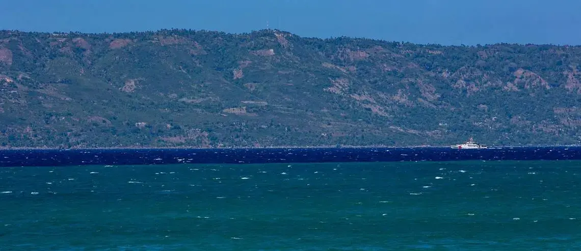 A US Coast Guard patrolling the shore