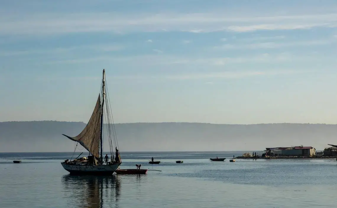 A sailboat prepares to leave