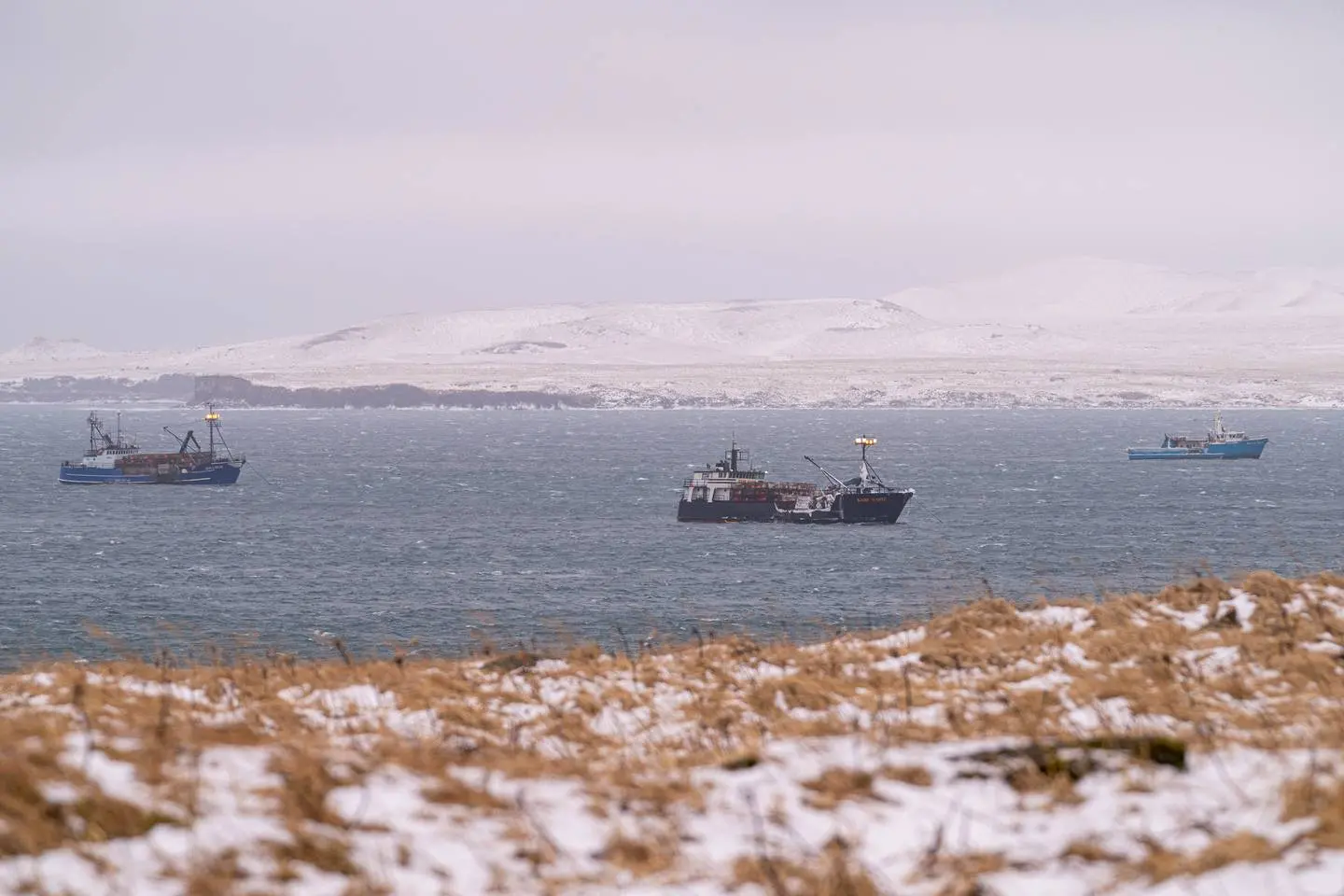 From left, the fishing boats Billikin, Kari Marie, and Silver Spray wait out a storm in the lee of St. Paul Island