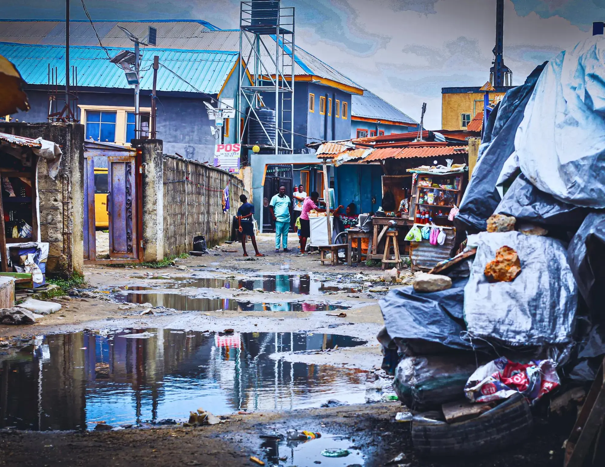 The absence of proper drainage channels and gutters in houses has led to rainwater accumulating on the streets in Iwaya, Lagos, Nigeria, 2023.