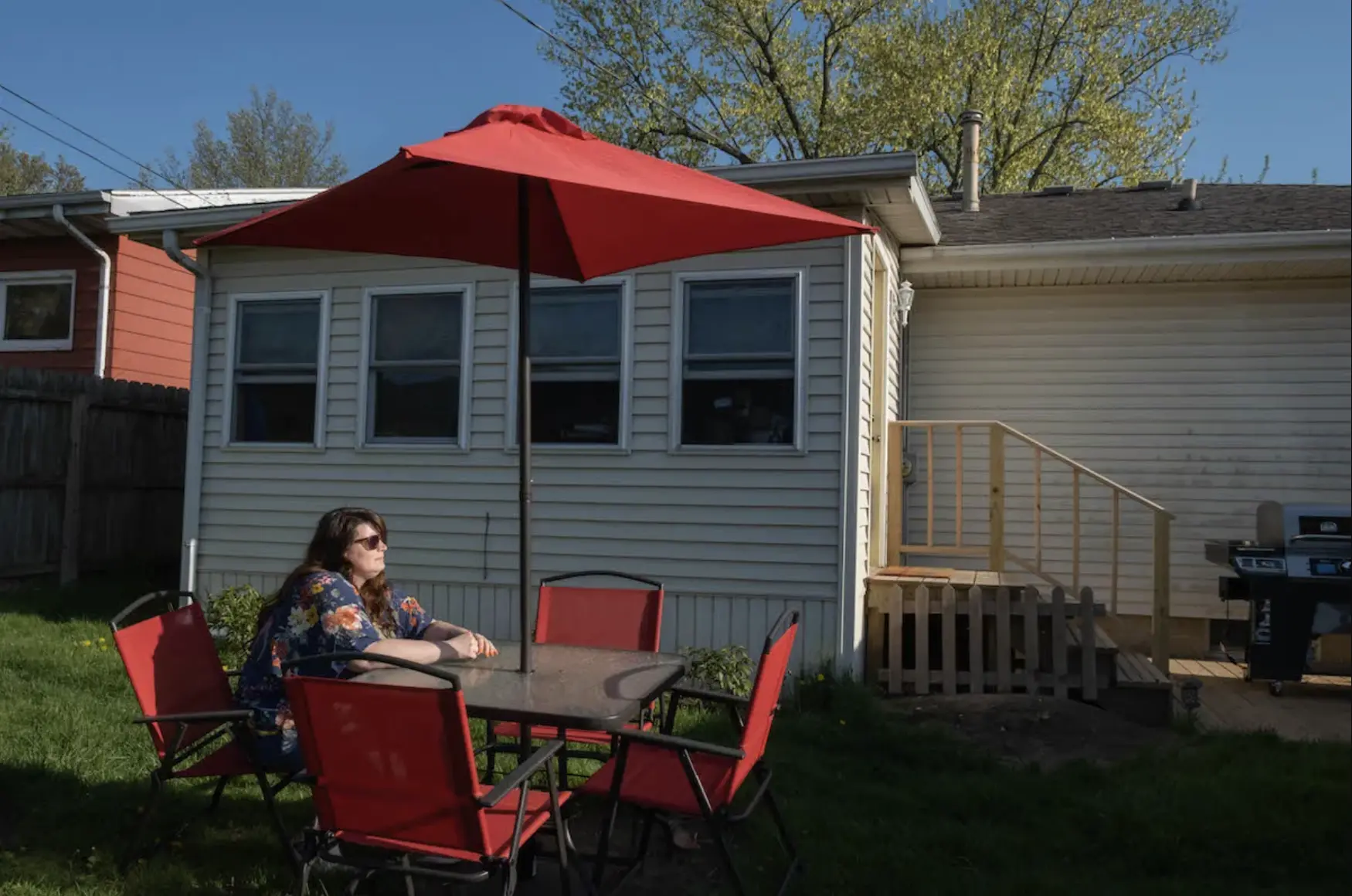 Jenny at table in backyard